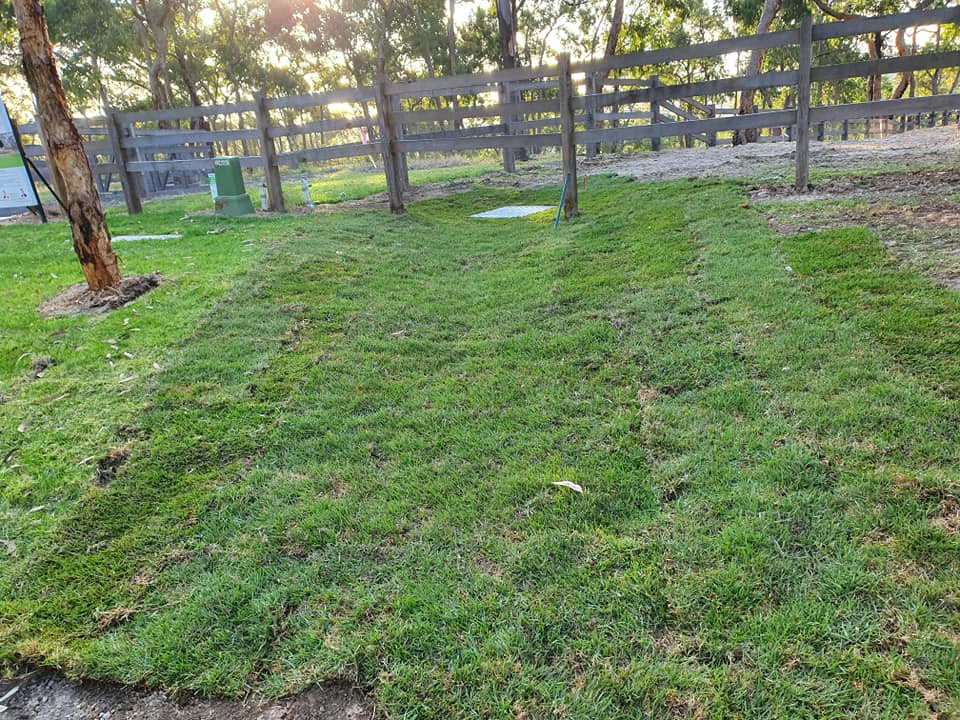 sump pit installation covered by grass on rural land