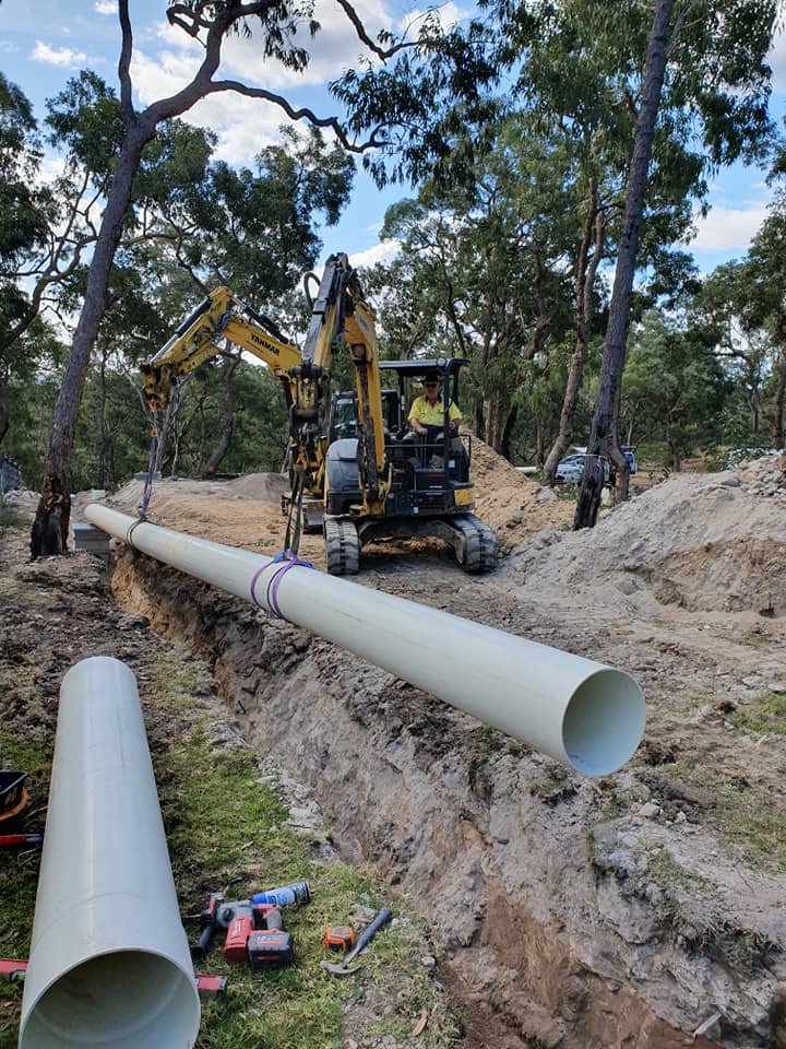 Sewerage pipe installation on farmland rural property