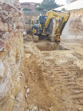 Residential land excavation with yanmar sprocket and drill